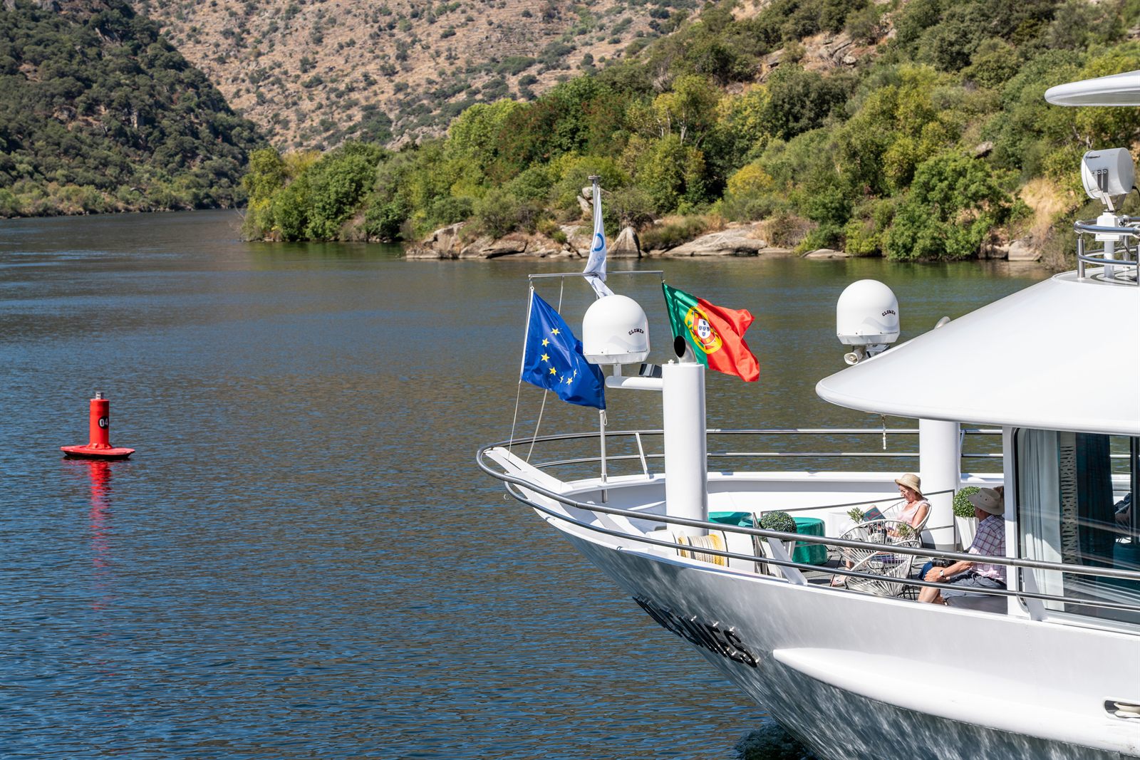 Bow of a modern river cruise ship sailing through the Douro Valley in Portugal