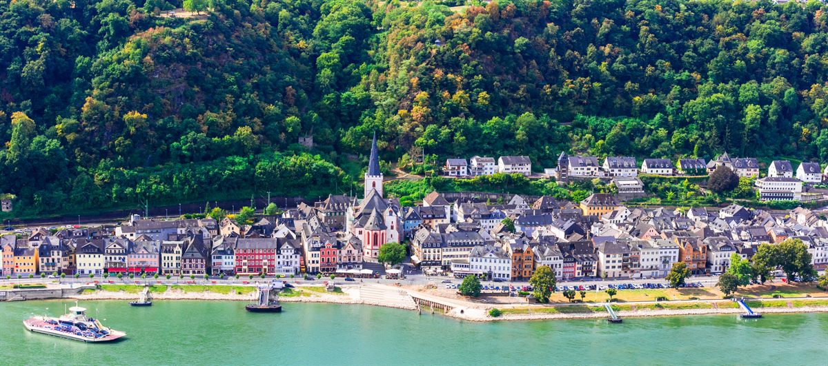 River cruise ship moored by a riverside town